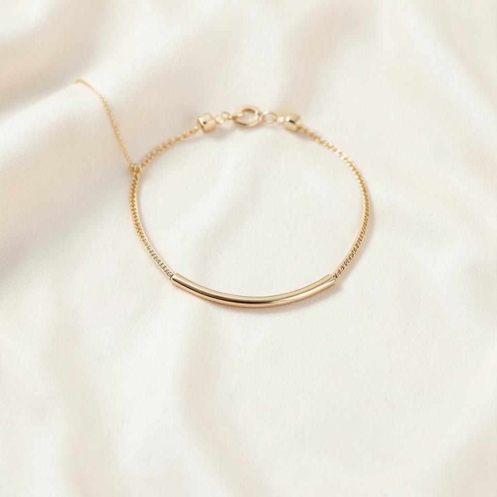 Beso slim gold choker with a smooth curved bar centrepiece on ivory silk